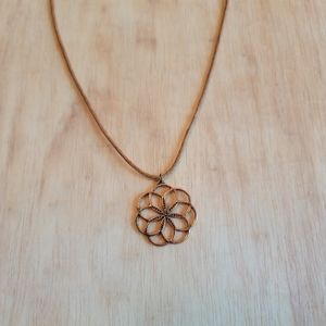 Copper Flower Necklace on light brown cord